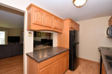 Enjoy open-concept living in this modern upper-level condo on BlackStone Creek Golf Club in Wisconsin - for sale on GolfHomes.com, golf home, golf lot