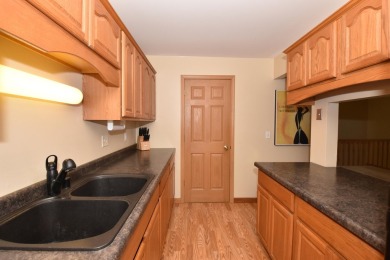 Enjoy open-concept living in this modern upper-level condo on BlackStone Creek Golf Club in Wisconsin - for sale on GolfHomes.com, golf home, golf lot