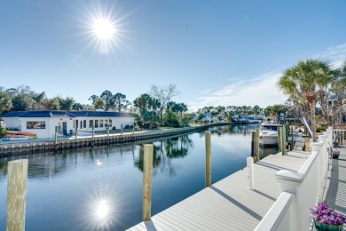 Tucked behind the private gates of the Bay Point community, this on Bay Point Resort Golf Club in Florida - for sale on GolfHomes.com, golf home, golf lot