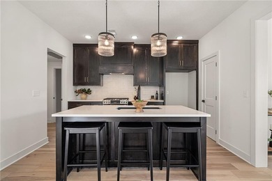 Discover modern, low-maintenance luxury living in this stunning on The Golf Club of Kansas in Kansas - for sale on GolfHomes.com, golf home, golf lot