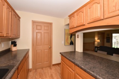 Enjoy open-concept living in this modern upper-level condo on BlackStone Creek Golf Club in Wisconsin - for sale on GolfHomes.com, golf home, golf lot