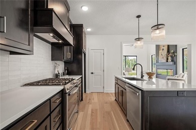 Discover modern, low-maintenance luxury living in this stunning on The Golf Club of Kansas in Kansas - for sale on GolfHomes.com, golf home, golf lot