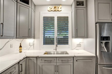 Live in the charming, historic Parrot Cove neighborhood of Lake on Lake Worth Municipal Golf Course in Florida - for sale on GolfHomes.com, golf home, golf lot