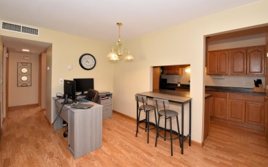 Enjoy open-concept living in this modern upper-level condo on BlackStone Creek Golf Club in Wisconsin - for sale on GolfHomes.com, golf home, golf lot