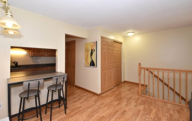 Enjoy open-concept living in this modern upper-level condo on BlackStone Creek Golf Club in Wisconsin - for sale on GolfHomes.com, golf home, golf lot