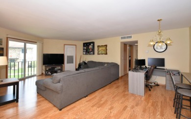 Enjoy open-concept living in this modern upper-level condo on BlackStone Creek Golf Club in Wisconsin - for sale on GolfHomes.com, golf home, golf lot