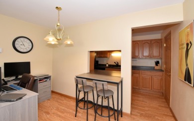Enjoy open-concept living in this modern upper-level condo on BlackStone Creek Golf Club in Wisconsin - for sale on GolfHomes.com, golf home, golf lot