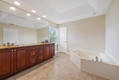 Nestled in a cul-de-sac in the sought-after community of Egret on The Golf Club of Jupiter in Florida - for sale on GolfHomes.com, golf home, golf lot