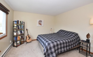 Enjoy open-concept living in this modern upper-level condo on BlackStone Creek Golf Club in Wisconsin - for sale on GolfHomes.com, golf home, golf lot