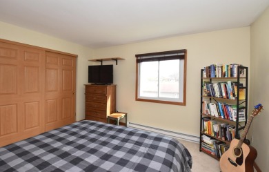 Enjoy open-concept living in this modern upper-level condo on BlackStone Creek Golf Club in Wisconsin - for sale on GolfHomes.com, golf home, golf lot