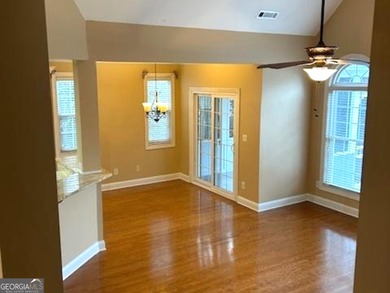 Welcome Home! Charming ranch plan with airy 2-story foyer in on Canongate At Flat Creek Club in Georgia - for sale on GolfHomes.com, golf home, golf lot