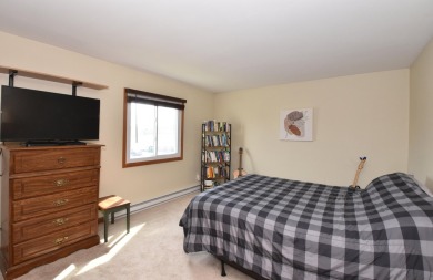 Enjoy open-concept living in this modern upper-level condo on BlackStone Creek Golf Club in Wisconsin - for sale on GolfHomes.com, golf home, golf lot