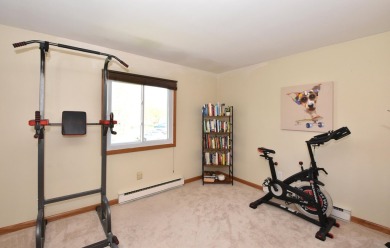 Enjoy open-concept living in this modern upper-level condo on BlackStone Creek Golf Club in Wisconsin - for sale on GolfHomes.com, golf home, golf lot