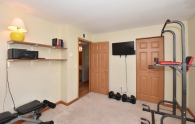 Enjoy open-concept living in this modern upper-level condo on BlackStone Creek Golf Club in Wisconsin - for sale on GolfHomes.com, golf home, golf lot