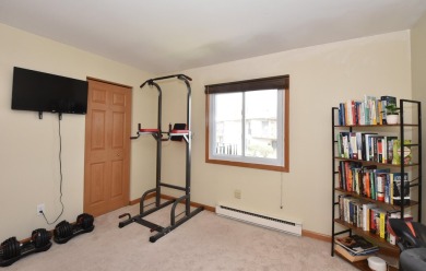 Enjoy open-concept living in this modern upper-level condo on BlackStone Creek Golf Club in Wisconsin - for sale on GolfHomes.com, golf home, golf lot