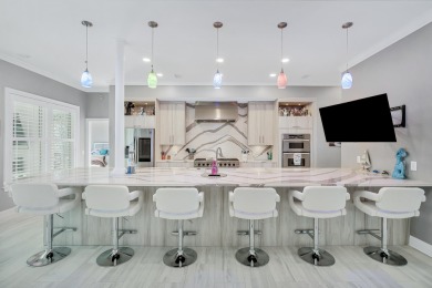 Tucked behind the private gates of the Bay Point community, this on Bay Point Resort Golf Club in Florida - for sale on GolfHomes.com, golf home, golf lot