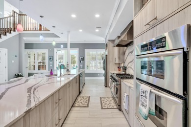 Tucked behind the private gates of the Bay Point community, this on Bay Point Resort Golf Club in Florida - for sale on GolfHomes.com, golf home, golf lot
