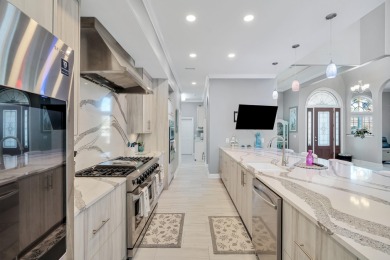 Tucked behind the private gates of the Bay Point community, this on Bay Point Resort Golf Club in Florida - for sale on GolfHomes.com, golf home, golf lot