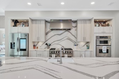 Tucked behind the private gates of the Bay Point community, this on Bay Point Resort Golf Club in Florida - for sale on GolfHomes.com, golf home, golf lot