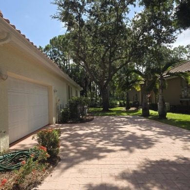 Welcome to 8212 Kiawah Trace, an exquisite custom-built on PGA Golf Club in PGA Village in Florida - for sale on GolfHomes.com, golf home, golf lot