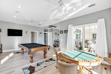 Tucked behind the private gates of the Bay Point community, this on Bay Point Resort Golf Club in Florida - for sale on GolfHomes.com, golf home, golf lot