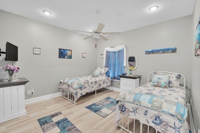 Tucked behind the private gates of the Bay Point community, this on Bay Point Resort Golf Club in Florida - for sale on GolfHomes.com, golf home, golf lot