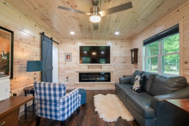 Meticulously maintained and beautifully updated, this stunning on Indian River Golf Club in Michigan - for sale on GolfHomes.com, golf home, golf lot