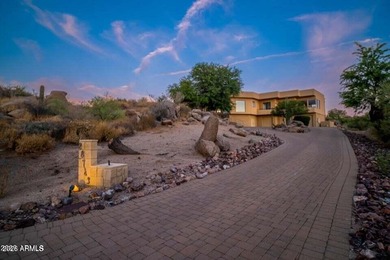 The Belgard pavers of the circular driveway lead up to this on Troon North Golf Club  in Arizona - for sale on GolfHomes.com, golf home, golf lot
