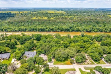 ENCHANTING 3-3-2 home nestled on a beautiful 1+ acre riverfront on Pecan Plantation Country Club in Texas - for sale on GolfHomes.com, golf home, golf lot