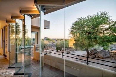 The Belgard pavers of the circular driveway lead up to this on Troon North Golf Club  in Arizona - for sale on GolfHomes.com, golf home, golf lot