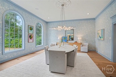 Midpoint Masterpiece - where mornings begin on the porch and on The Landings Club - Palmetto in Georgia - for sale on GolfHomes.com, golf home, golf lot