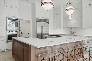 Midpoint Masterpiece - where mornings begin on the porch and on The Landings Club - Palmetto in Georgia - for sale on GolfHomes.com, golf home, golf lot