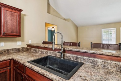 You'll blend with nature in this all brick, 3-bedroom, 2-bath on The Club At Hidden Creek in Florida - for sale on GolfHomes.com, golf home, golf lot
