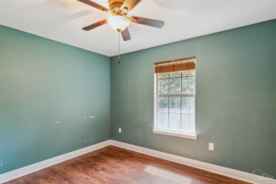 You'll blend with nature in this all brick, 3-bedroom, 2-bath on The Club At Hidden Creek in Florida - for sale on GolfHomes.com, golf home, golf lot