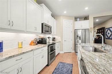 PARK THE GOLF CART, STORE THE TOYS, INVITE THE FRIENDS. THIS on Herons Glen Golf and Country Club in Florida - for sale on GolfHomes.com, golf home, golf lot