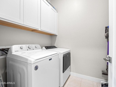 Private secure and easy living nestled by the beautiful Palm on Palm Valley Golf Club  in Arizona - for sale on GolfHomes.com, golf home, golf lot