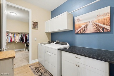 PARK THE GOLF CART, STORE THE TOYS, INVITE THE FRIENDS. THIS on Herons Glen Golf and Country Club in Florida - for sale on GolfHomes.com, golf home, golf lot