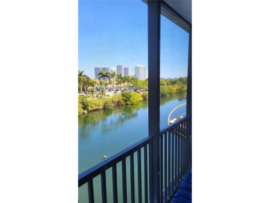 Enjoy the wrap-around screened balcony with amazing Marina and on Turnberry Isle Resort and Club in Florida - for sale on GolfHomes.com, golf home, golf lot