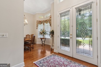 Step into a world of elegance and comfort with this timeless on Laurel Island Links in Georgia - for sale on GolfHomes.com, golf home, golf lot