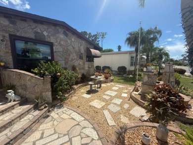 This well-cared for Palm Harbor home is being sold fully on Del Tura Golf and Country Club in Florida - for sale on GolfHomes.com, golf home, golf lot