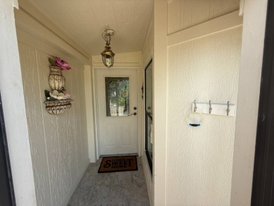 This well-cared for Palm Harbor home is being sold fully on Del Tura Golf and Country Club in Florida - for sale on GolfHomes.com, golf home, golf lot