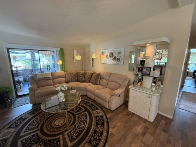 This well-cared for Palm Harbor home is being sold fully on Del Tura Golf and Country Club in Florida - for sale on GolfHomes.com, golf home, golf lot