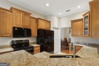 Step into a world of elegance and comfort with this timeless on Laurel Island Links in Georgia - for sale on GolfHomes.com, golf home, golf lot