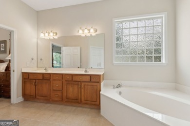 Step into a world of elegance and comfort with this timeless on Laurel Island Links in Georgia - for sale on GolfHomes.com, golf home, golf lot
