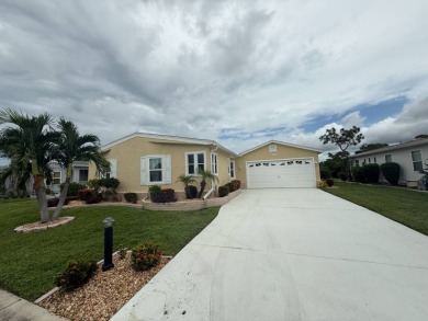 This beautiful Palm Harbor stucco is ready for new owners to on Del Tura Golf and Country Club in Florida - for sale on GolfHomes.com, golf home, golf lot