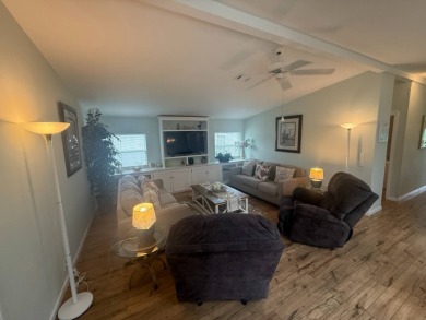 This beautiful Palm Harbor stucco is ready for new owners to on Del Tura Golf and Country Club in Florida - for sale on GolfHomes.com, golf home, golf lot