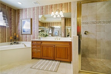 Experience refined coach home living in this beautifully on West Bay Beach and Golf Club in Florida - for sale on GolfHomes.com, golf home, golf lot