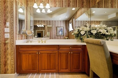 Experience refined coach home living in this beautifully on West Bay Beach and Golf Club in Florida - for sale on GolfHomes.com, golf home, golf lot