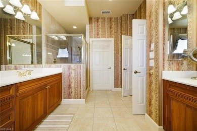 Experience refined coach home living in this beautifully on West Bay Beach and Golf Club in Florida - for sale on GolfHomes.com, golf home, golf lot