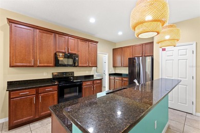 Simply stunning, this 5-bedroom, 4.5-bathroom pool home sits on on Providence Golf Club in Florida - for sale on GolfHomes.com, golf home, golf lot